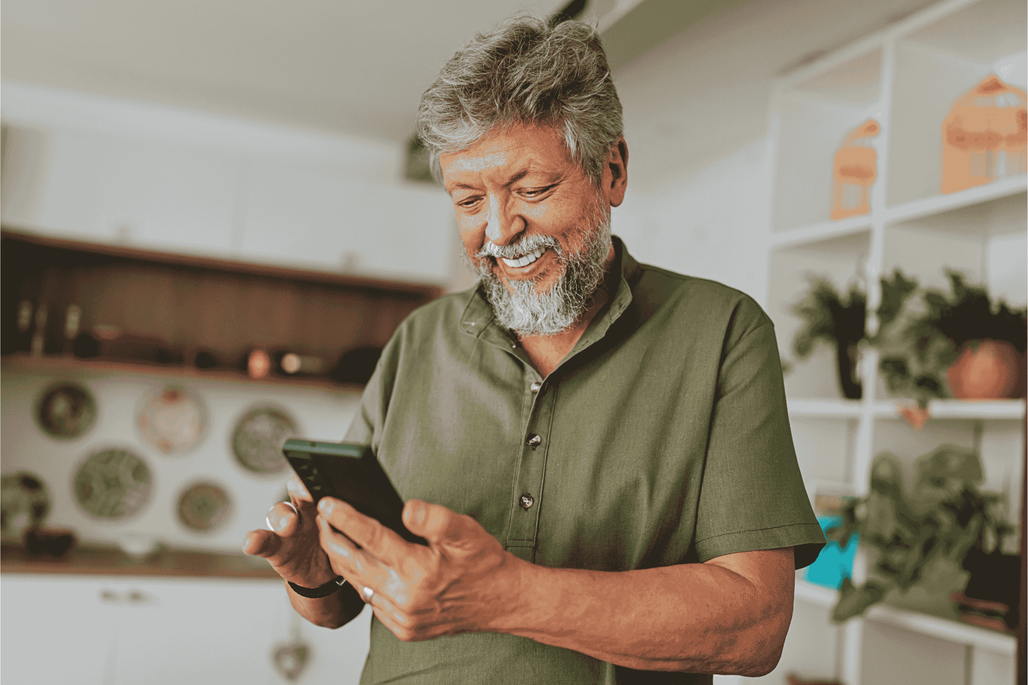 man works joyfully on his phone