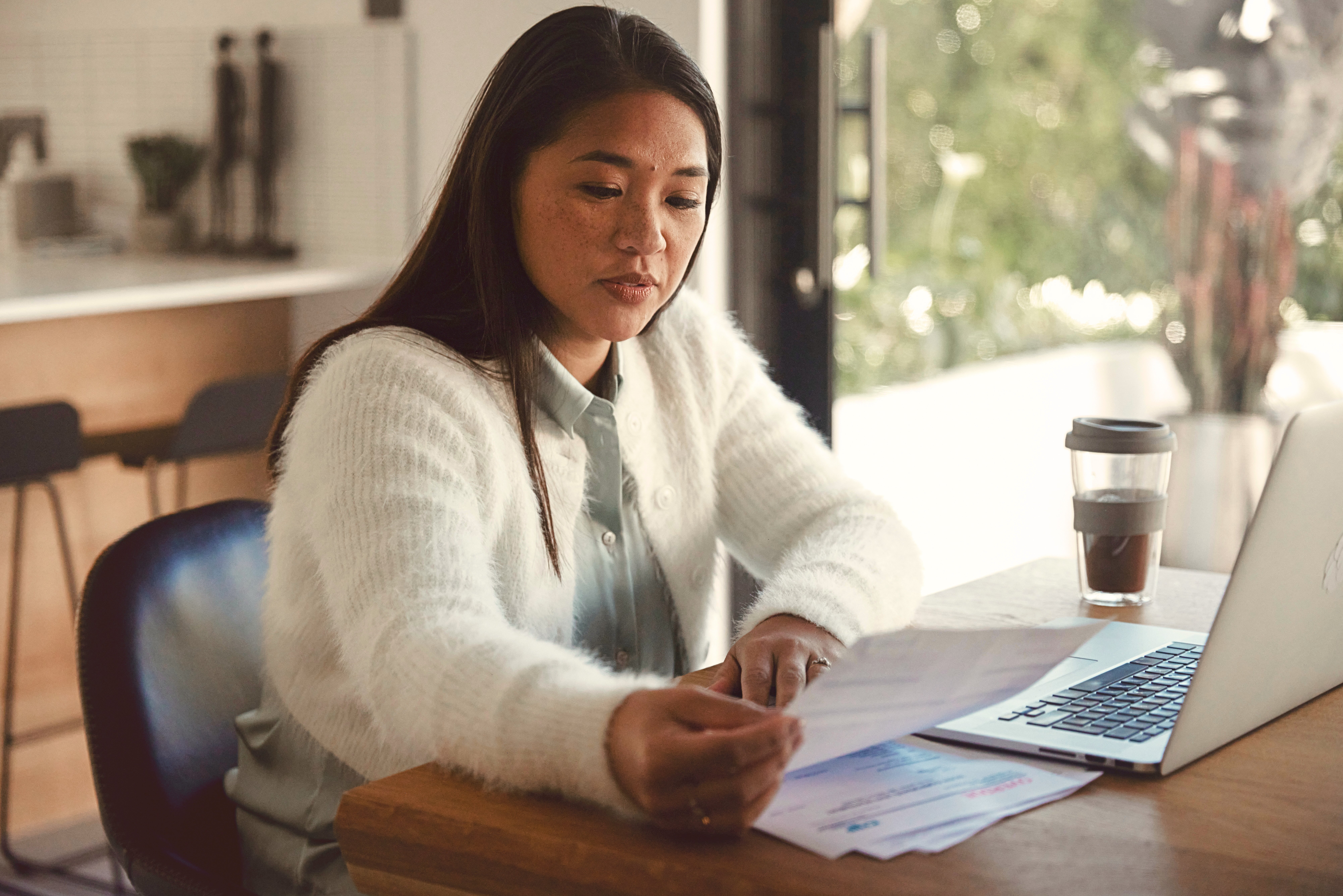 woman working at her laptop on her finances