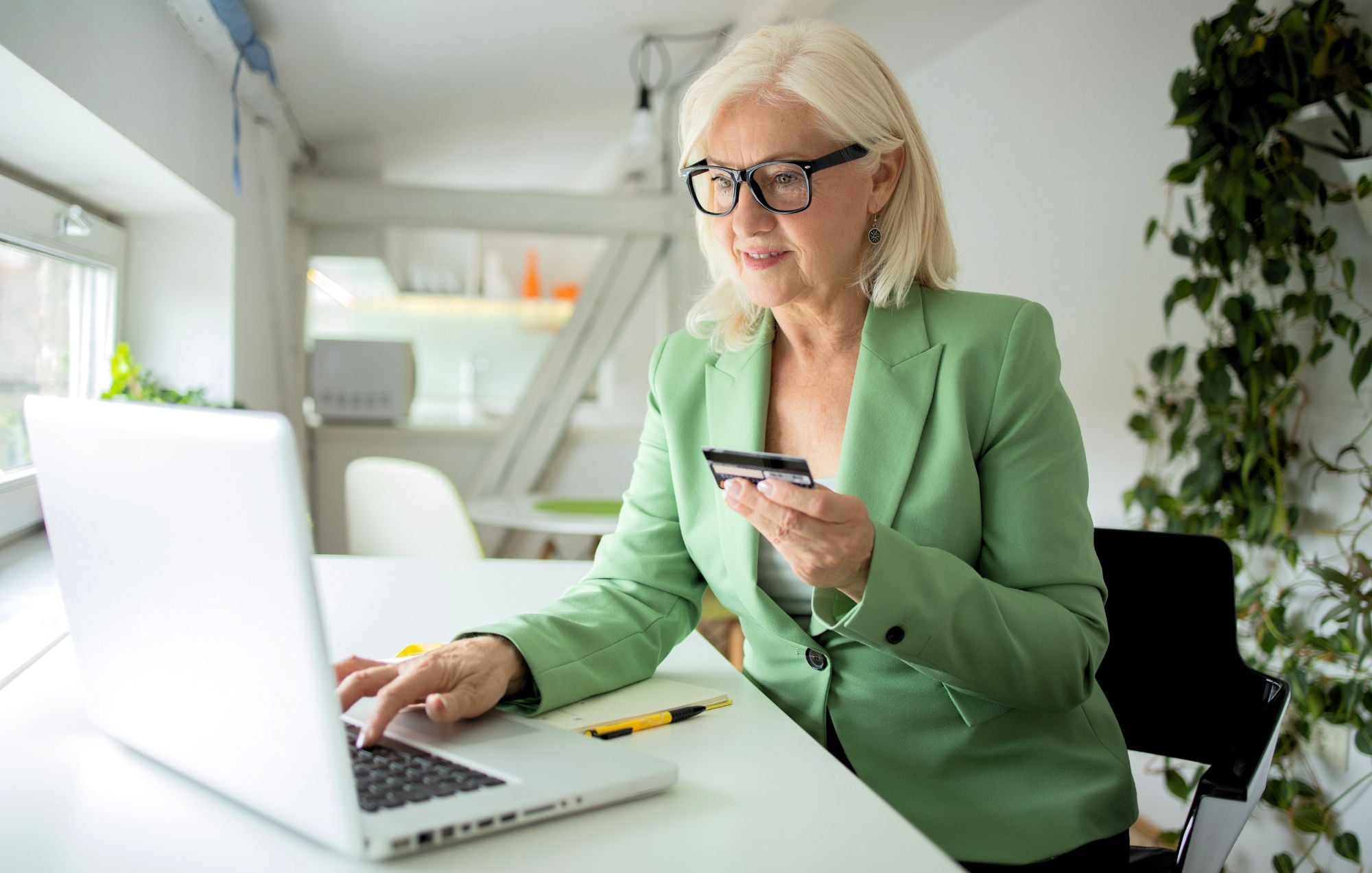 senior woman with card