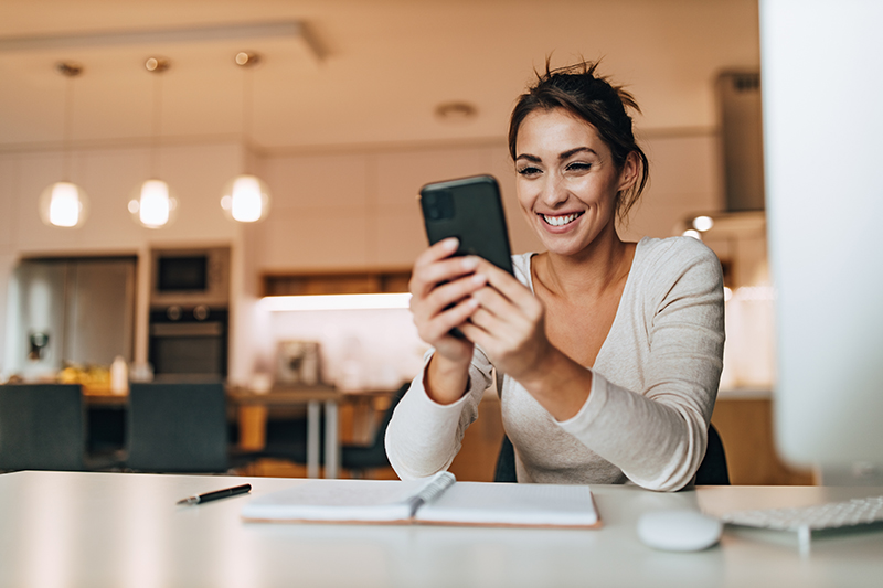 woman managing finances on phone