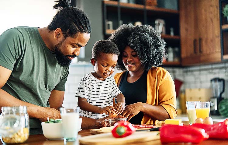 Family cooking in kitchen