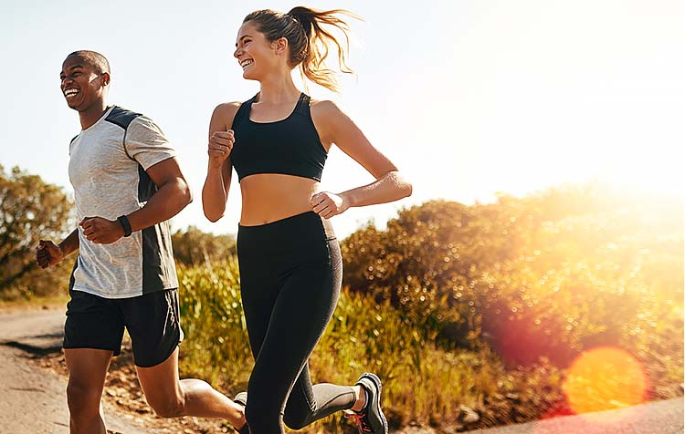 Man and woman running outside