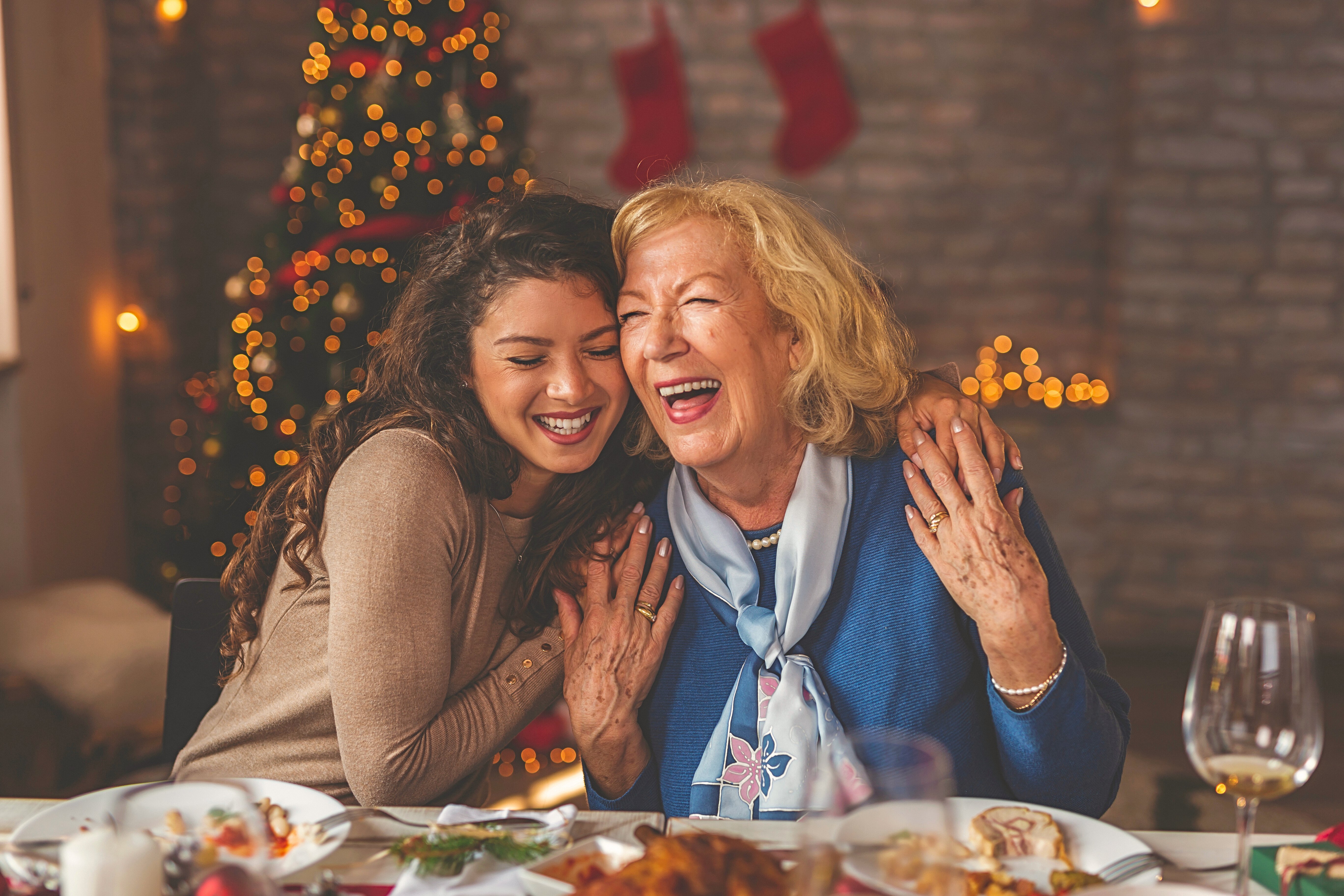 mother and daughter hugging during the holidays